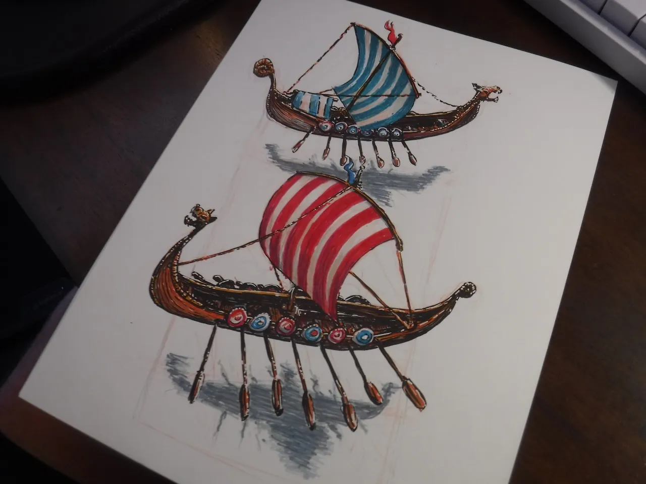 Two colorful hand-drawn Viking longships with striped sails
